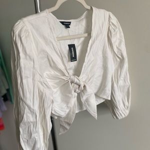 Express tie front blouse with puff shoulder. More of an off white.